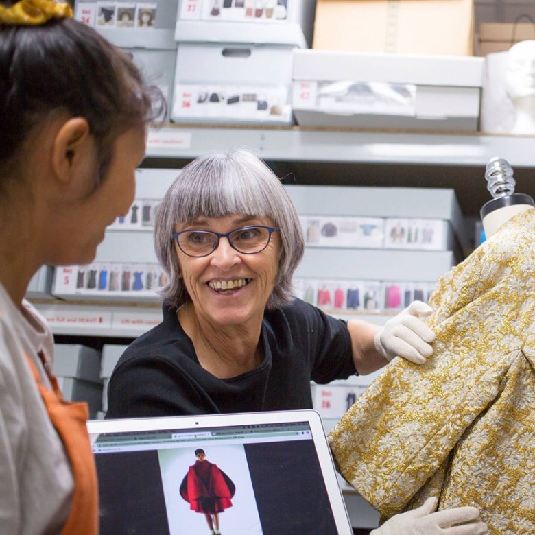 Di Downs working with two students in the costume stores at Falmouth University